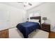 Well-lit bedroom with hardwood floors, a window and two bedside tables with lamps at 1320 Hosea L Williams Ne Dr, Atlanta, GA 30317