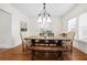 Stylish dining room featuring a farmhouse-style table, bench, and modern chandelier at 1320 Hosea L Williams Ne Dr, Atlanta, GA 30317