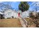 Bungalow-style home featuring a red front door and a well-manicured lawn at 1320 Hosea L Williams Ne Dr, Atlanta, GA 30317