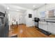 Well-lit kitchen with white cabinetry, stainless steel appliances, and a view into the breakfast nook at 1320 Hosea L Williams Ne Dr, Atlanta, GA 30317