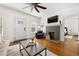 Inviting living room featuring a fireplace, hardwood floors, and ample natural light at 1320 Hosea L Williams Ne Dr, Atlanta, GA 30317