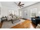 Bright living room with hardwood floors, a ceiling fan, and a view into the dining room at 1320 Hosea L Williams Ne Dr, Atlanta, GA 30317