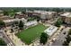 Charming aerial view of a green space surrounded by shops and restaurants in a bustling neighborhood at 145 Alcovy Ter, Alpharetta, GA 30009