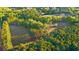 Expansive property showcasing lush greenery, mature trees, and a well-maintained lawn at 576 Tope Rd, Sharpsburg, GA 30277