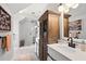 Bathroom featuring a double vanity, modern cabinetry, and glass shower with tiled walls at 576 Tope Rd, Sharpsburg, GA 30277