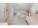 Bright bedroom with a chandelier, pink carpet, a bed, and modern decor at 576 Tope Rd, Sharpsburg, GA 30277