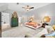 Expansive primary bedroom with sitting area, large windows, and neutral color palette at 576 Tope Rd, Sharpsburg, GA 30277