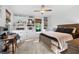 Bright bedroom with ceiling fan, built-in shelves and cabinets, a window seat, and neutral decor at 576 Tope Rd, Sharpsburg, GA 30277