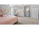 Bright bedroom with a bed, large closet, and a vanity desk at 576 Tope Rd, Sharpsburg, GA 30277