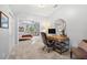 Bonus room featuring gray paint and carpet, desk area and doorway to bedroom with sitting area at 576 Tope Rd, Sharpsburg, GA 30277