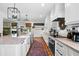 Stylish kitchen with granite countertops, modern appliances, and open access to dining at 576 Tope Rd, Sharpsburg, GA 30277