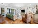 Bright living room with hardwood floors, a gallery wall and plush seating at 576 Tope Rd, Sharpsburg, GA 30277
