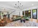 Bright living room with hardwood floors, fireplace, and access to outdoor space at 576 Tope Rd, Sharpsburg, GA 30277