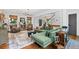 Spacious living room featuring hardwood floors, comfortable seating, and stylish decor at 576 Tope Rd, Sharpsburg, GA 30277