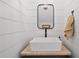 Modern powder room with shiplap walls, granite countertop and unique vessel sink at 576 Tope Rd, Sharpsburg, GA 30277