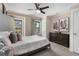 Comfortable bedroom with a large bed, complemented by two windows and a dresser at 738 Saint Charles Ne Ave, Atlanta, GA 30306