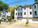 Charming townhome featuring a two-car garage and blue and white exterior paint at 738 Saint Charles Ne Ave, Atlanta, GA 30306