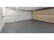 Large empty garage with a gray floor and overhead lighting at 738 Saint Charles Ne Ave, Atlanta, GA 30306