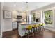 Bright kitchen with a large island, stainless steel appliances, pendant lighting, and views to the outside at 738 Saint Charles Ne Ave, Atlanta, GA 30306