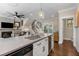Well-designed kitchen with a large island, stainless steel appliances, and easy access to the staircase at 738 Saint Charles Ne Ave, Atlanta, GA 30306