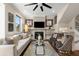 Comfortable living room with fireplace, large TV, stylish mirrors, and plush seating on a decorative rug at 738 Saint Charles Ne Ave, Atlanta, GA 30306