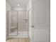 Modern bathroom featuring a glass shower with built-in seat at 131 Hampton Ter, Dallas, GA 30157