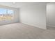 Bright, carpeted bedroom with a large window at 131 Hampton Ter, Dallas, GA 30157