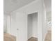 Hallway with white trim and doors showcasing access to a closet at 131 Hampton Ter, Dallas, GA 30157
