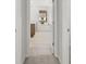 Hallway with hardwood floors leading to the bathroom at 131 Hampton Ter, Dallas, GA 30157