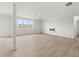 Bright living room featuring hardwood floors, large windows, and a modern fireplace at 131 Hampton Ter, Dallas, GA 30157