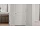 Hallway showing the entrance to a bathroom with white door at 171 Hampton Ter, Dallas, GA 30157