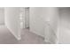 Hallway with neutral carpet and white trim leading to multiple rooms at 171 Hampton Ter, Dallas, GA 30157