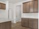 Kitchen showcases wood cabinets, granite countertops, a white subway tile backsplash, and light wood-look floors at 171 Hampton Ter, Dallas, GA 30157