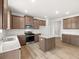 Stylish kitchen with stainless steel appliances, an island with a granite countertop, and plenty of storage at 171 Hampton Ter, Dallas, GA 30157