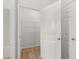 Pantry includes shelving for ample storage and is lit by overhead light at 171 Hampton Ter, Dallas, GA 30157