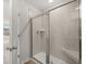 New shower with sleek glass door and tile walls at 171 Hampton Ter, Dallas, GA 30157