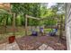 Backyard fire pit with Adirondack chairs and wooden pergola perfect for entertaining at 2136 Oak Knob Dr, Decatur, GA 30032