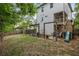 Spacious backyard with patio, wooden pergola, stairs to deck, slide, and fenced perimeter at 2136 Oak Knob Dr, Decatur, GA 30032