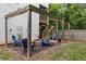 Cozy backyard fire pit area with wooden pergola and Adirondack chairs near wood fence and staircase at 2136 Oak Knob Dr, Decatur, GA 30032