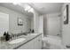 Bright bathroom featuring double vanity, granite counters, tile floors, and neutral colors at 2136 Oak Knob Dr, Decatur, GA 30032