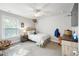 Cozy bedroom featuring neutral colors, natural light, ceiling fan, a comfortable bed and ample storage at 2136 Oak Knob Dr, Decatur, GA 30032