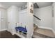 Stylish entryway with a built-in bench, storage baskets, and a staircase nearby at 2136 Oak Knob Dr, Decatur, GA 30032