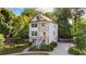 Charming three-story home featuring a welcoming entryway and a well-manicured front yard at 2136 Oak Knob Dr, Decatur, GA 30032