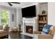 Elegant fireplace with a mounted TV and stylish built-in shelving, perfect for entertaining at 2136 Oak Knob Dr, Decatur, GA 30032