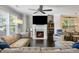 Cozy living room with a fireplace, large windows, and comfortable seating arrangements at 2136 Oak Knob Dr, Decatur, GA 30032