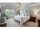 Spacious primary bedroom with trey ceiling, ceiling fan, and large picture window at 2136 Oak Knob Dr, Decatur, GA 30032