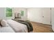 Cozy bedroom with hardwood flooring, natural light and simple, yet comfortable design at 2294 Salt Springs Pl, Austell, GA 30168