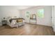 Serene bedroom with ample natural light, hardwood flooring, and neutral decor at 2294 Salt Springs Pl, Austell, GA 30168