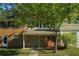 Attractive townhome showcasing a stone facade, covered porch, and landscaped front yard at 2294 Salt Springs Pl, Austell, GA 30168
