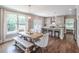 Open dining area featuring hardwood floors, ample natural light, and seating for six at 2675 Sugar Mill Dr, Atlanta, GA 30316
